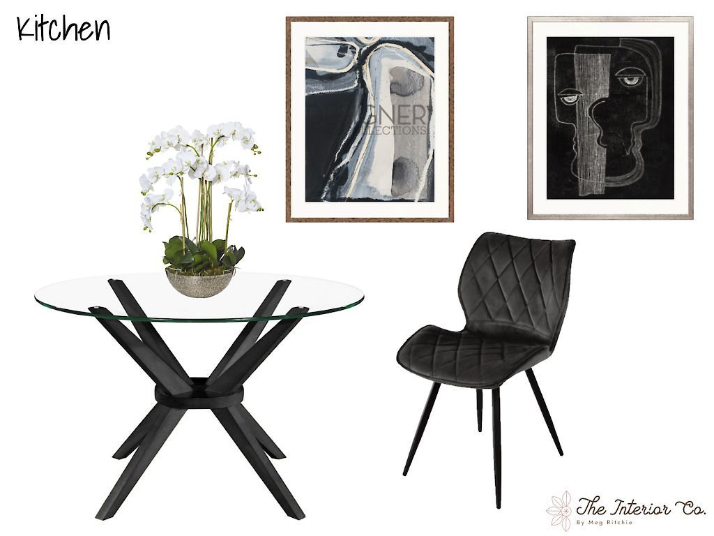 A kitchen with a table , chair , and paintings on the wall.