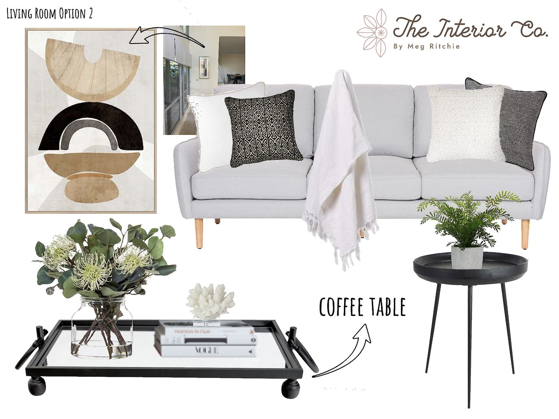 A living room with a white couch and a coffee table