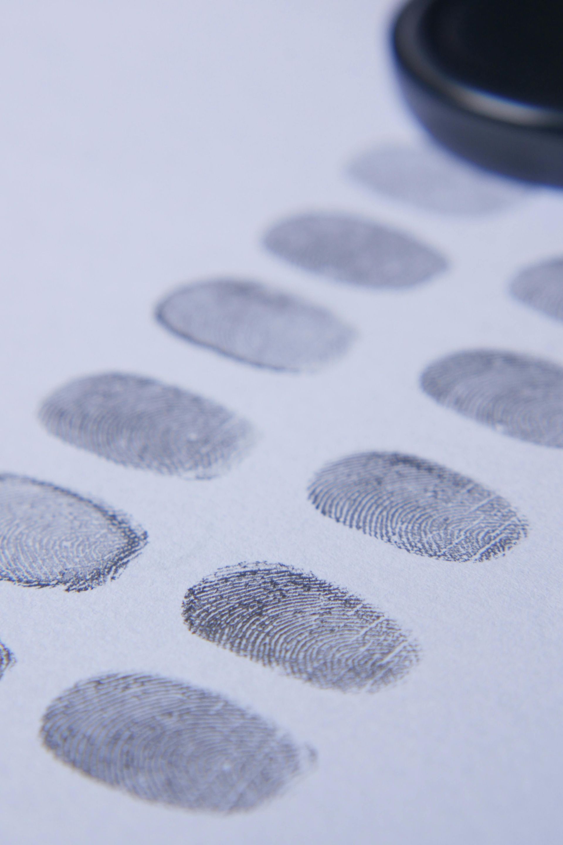 A close up of a row of fingerprint prints on a piece of paper.