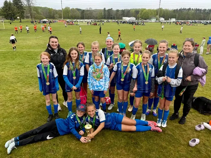 Youth team in blue uniforms