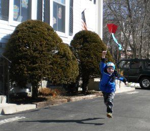 Boy Playing Kite — Child Care and Learning Center in Whitman and Braintree, MA