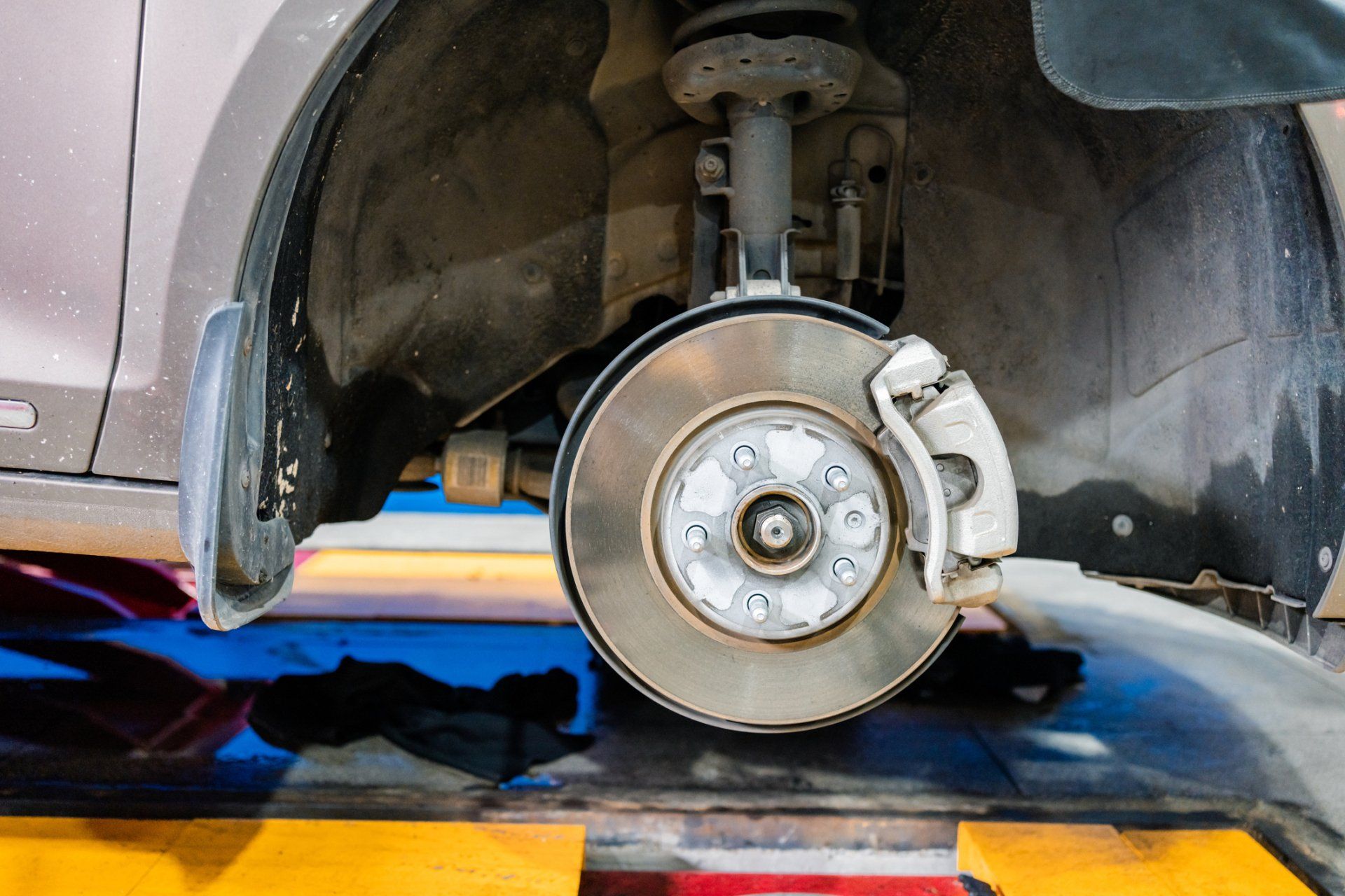 Mechanic Using Screw While Fixing Car Break — Wells, ME — Wells Auto Care