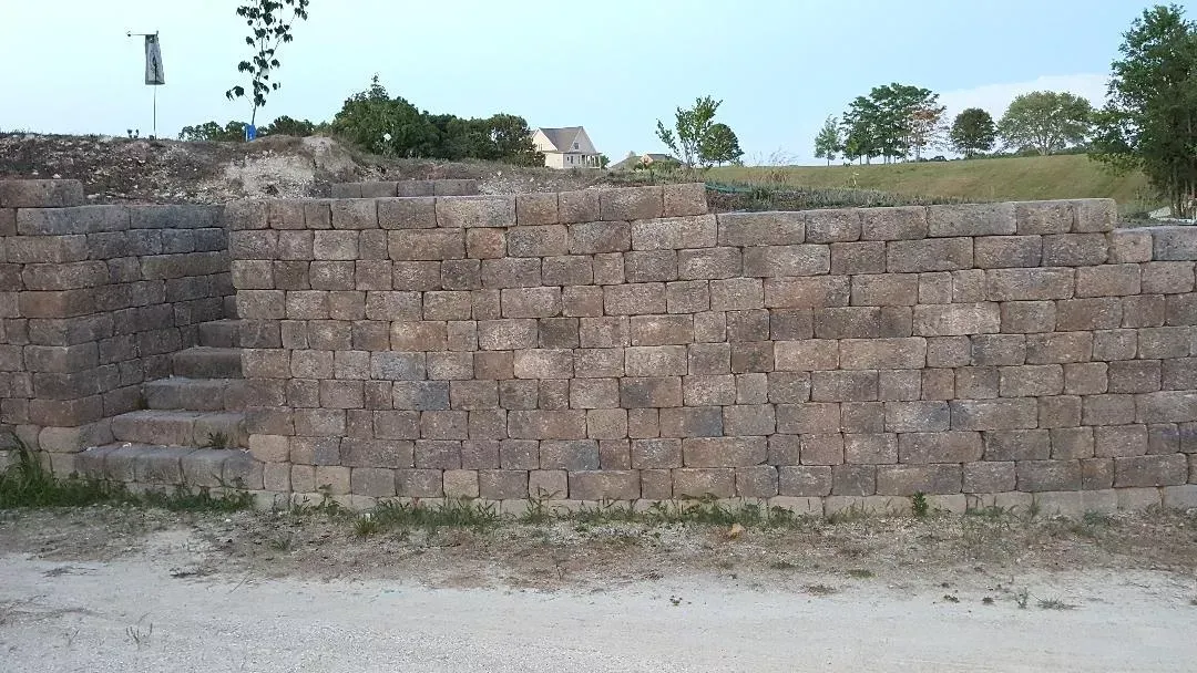 A large stone wall with stairs leading up to it