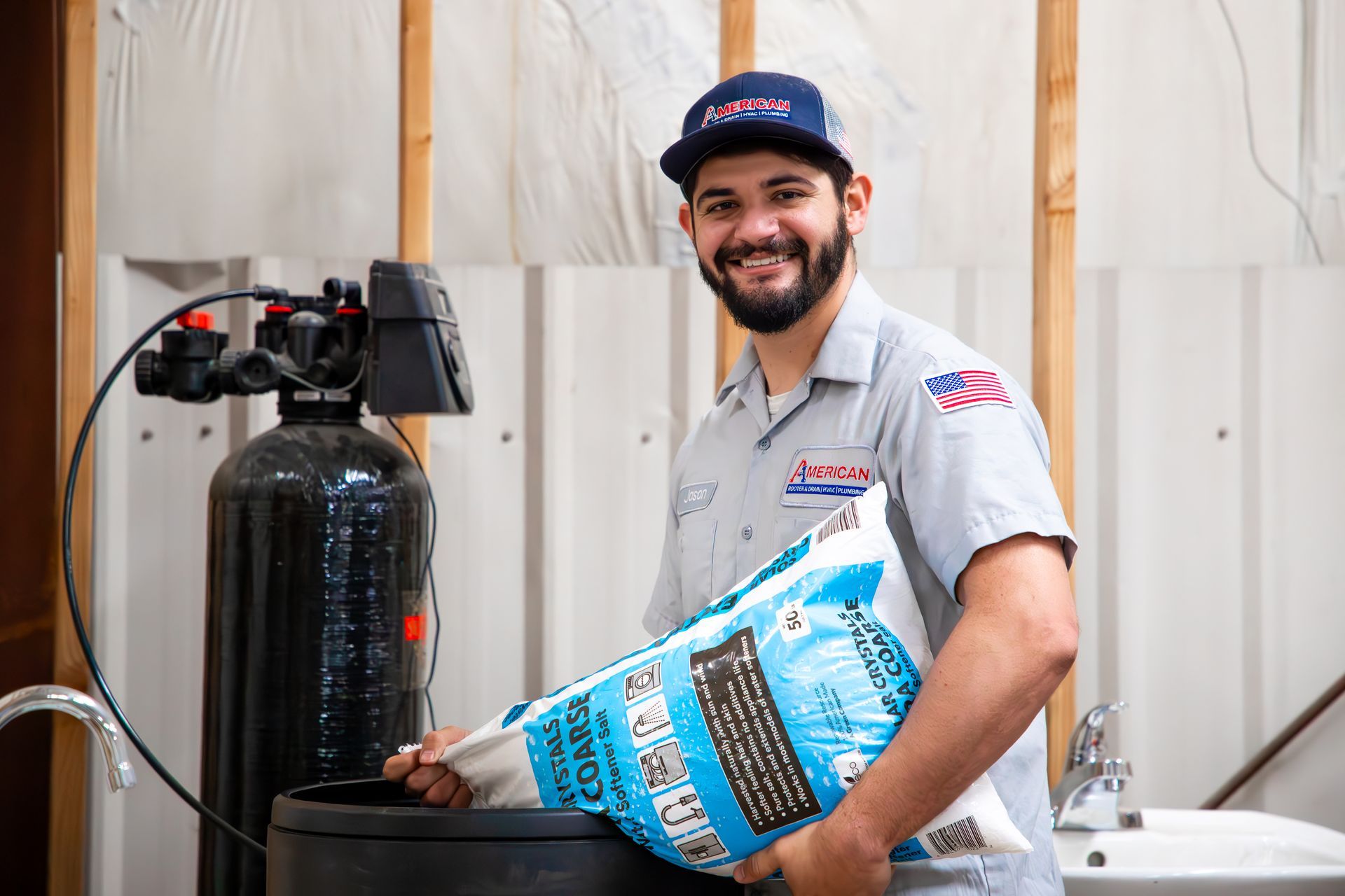 Jason Capistran, demonstrating where water softener gets poured in at our training center.