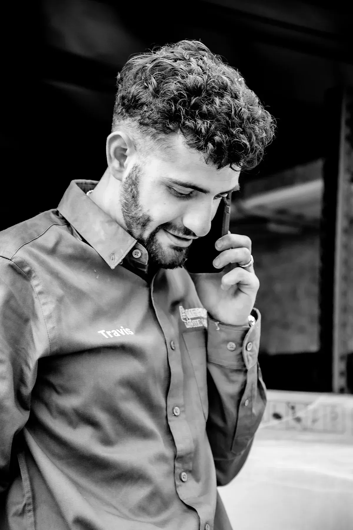 HVAC Tech taking customer's call on the install job-site