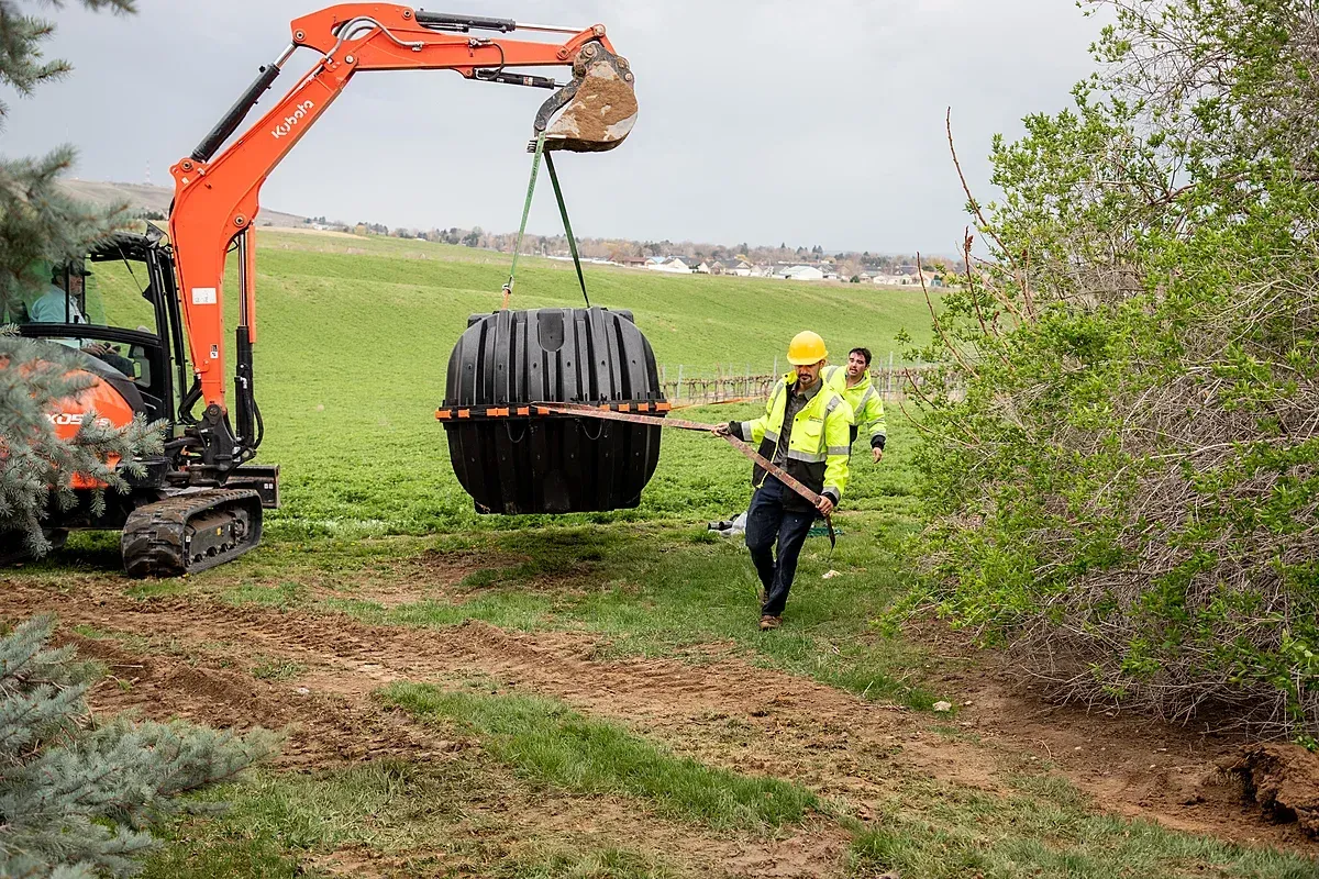 Septic Tank install crew moving tank