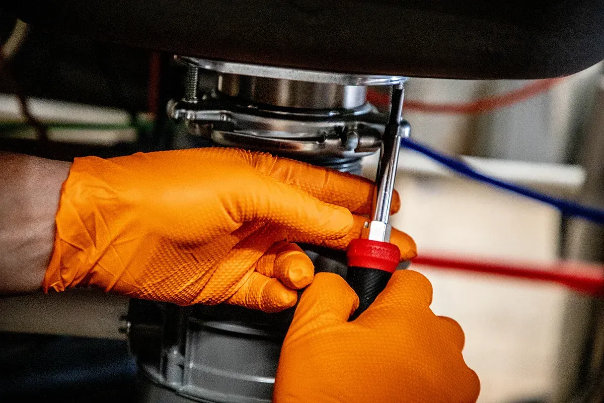 Under sink repairs being made