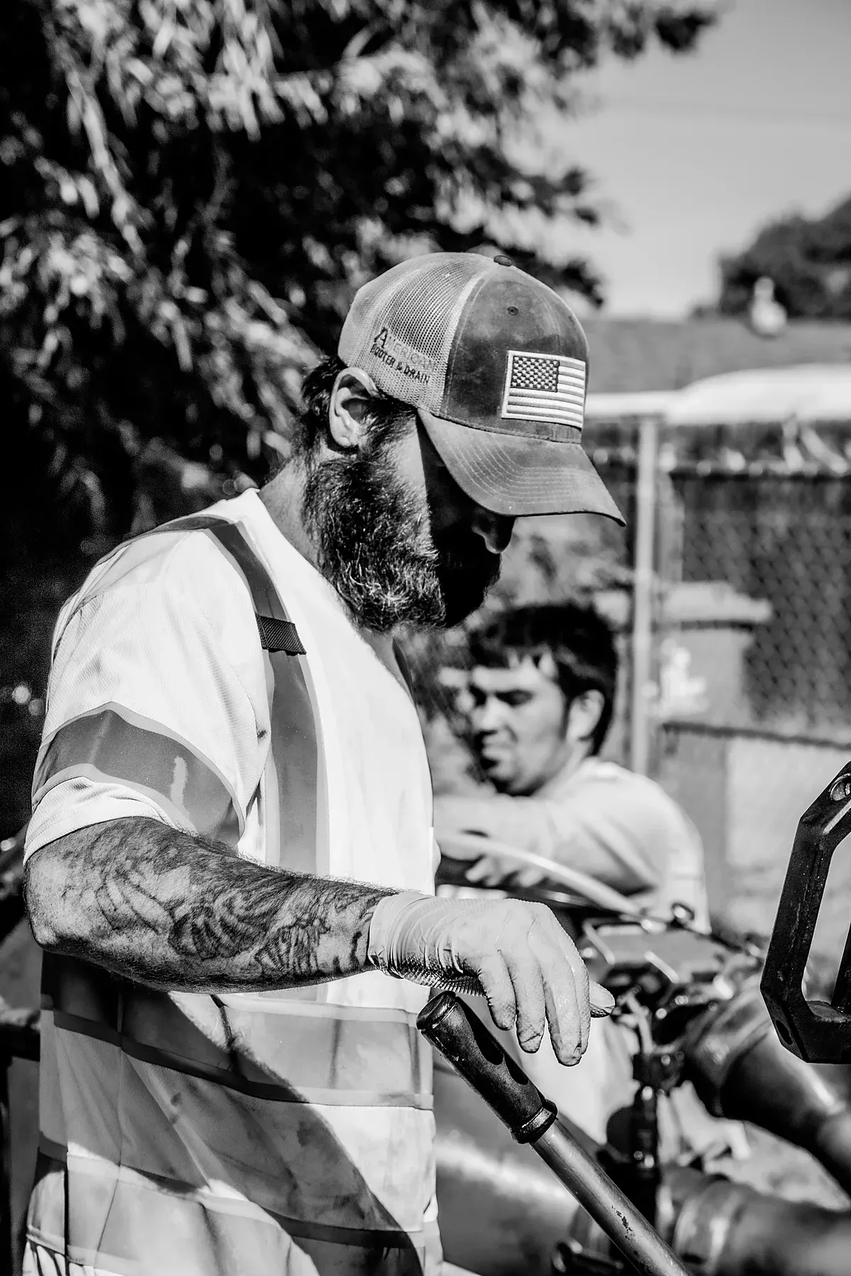 Plumber operating pipe repair blue light equipment