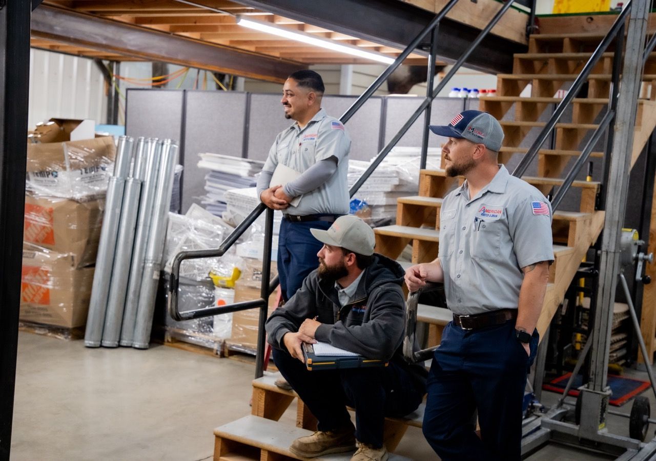 Technicians listening to morning meeting speaker