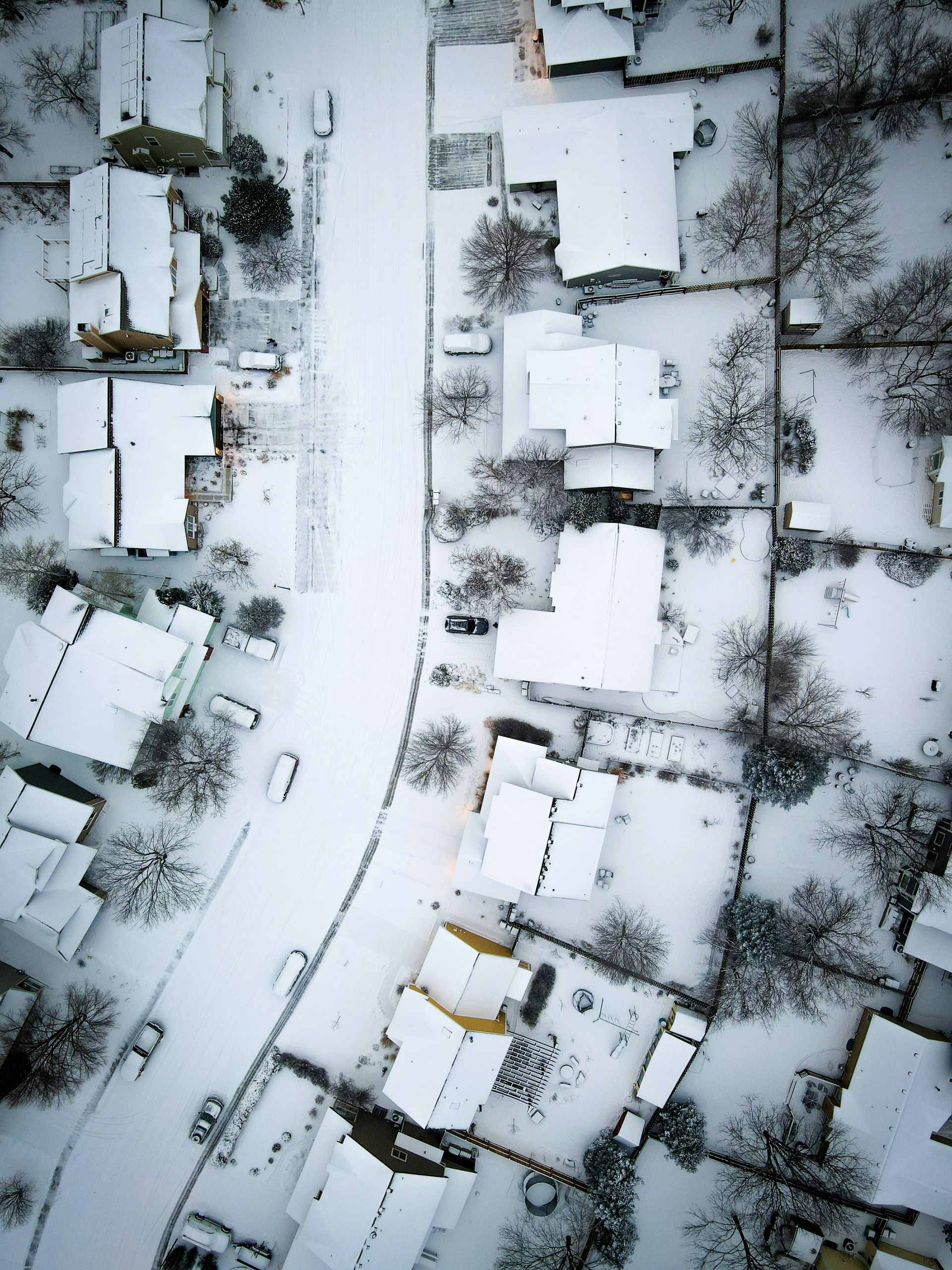 House in the winter with snow leading up to front door