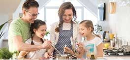 Family making a meal in kitchen