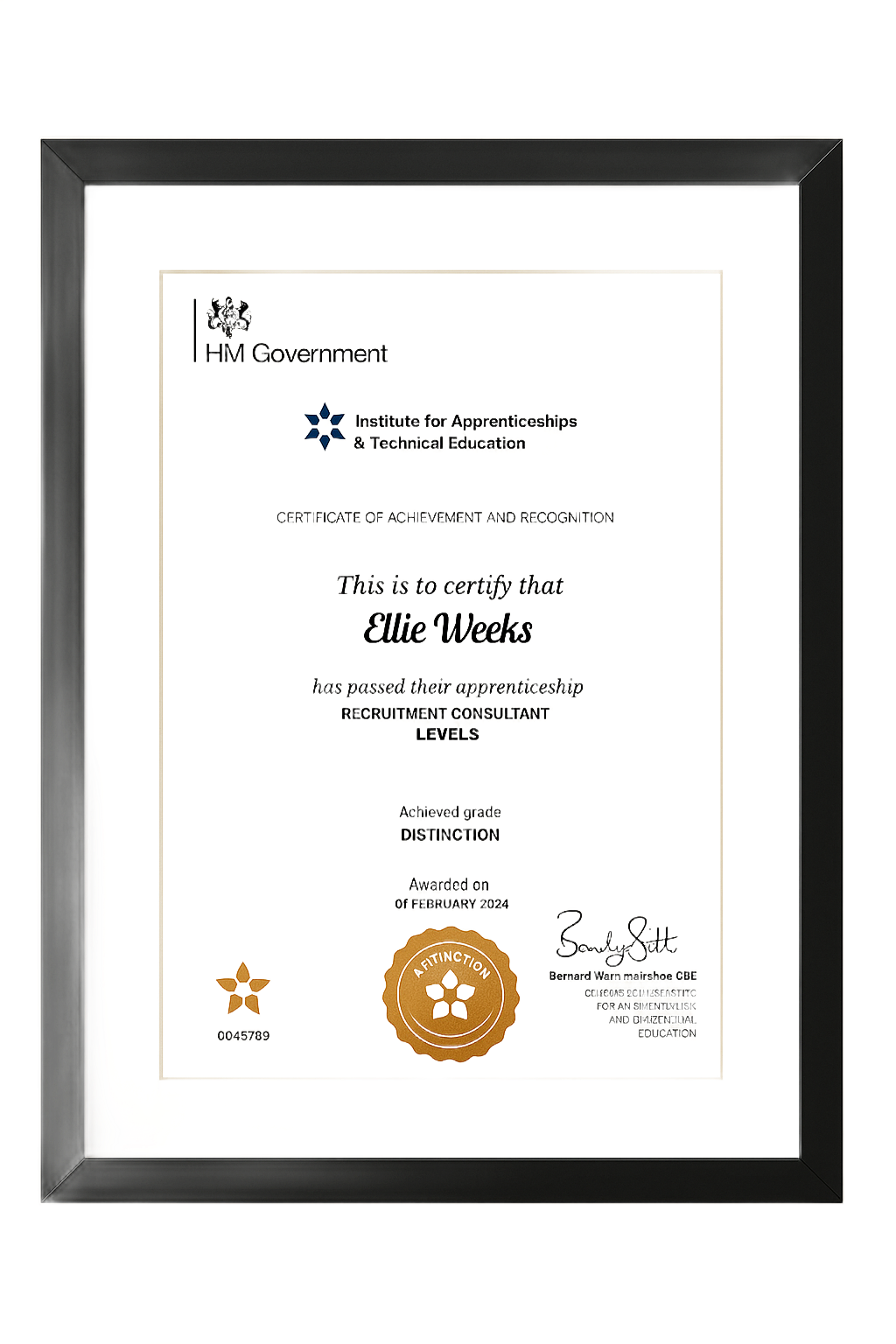 Certificate in a black frame, awarded to Ollie Weeks. Seal and signature visible.