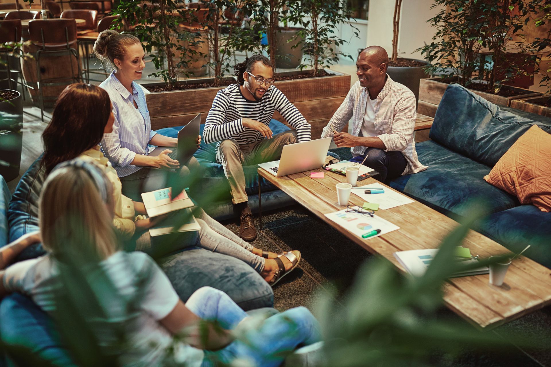 Business people sat round table