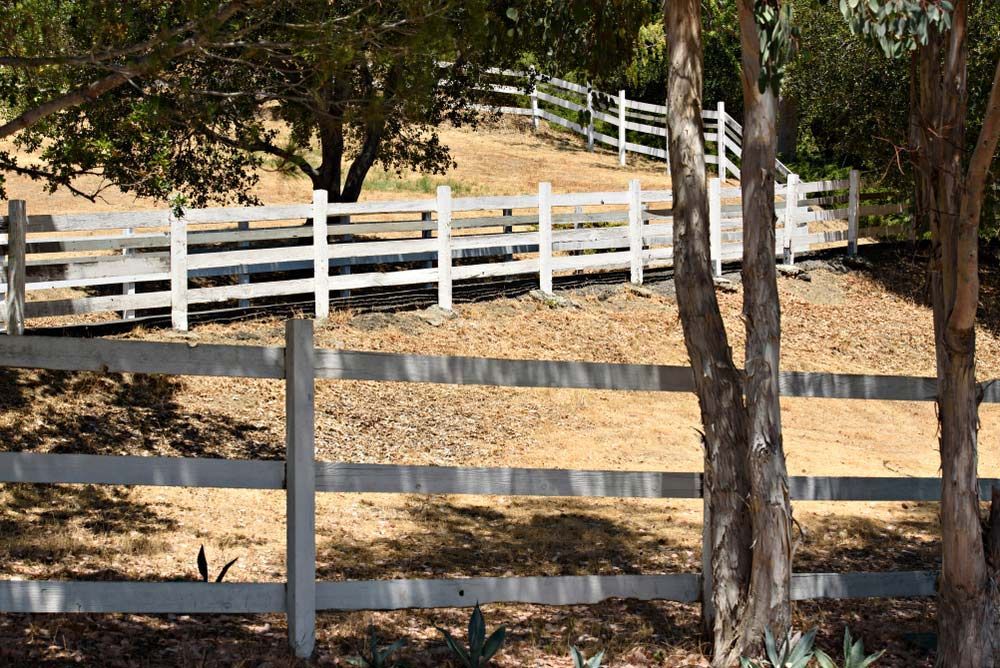 Rural Hillside With White Fencing — Lawrence Williams Fencing in Tweed Heads, NSW