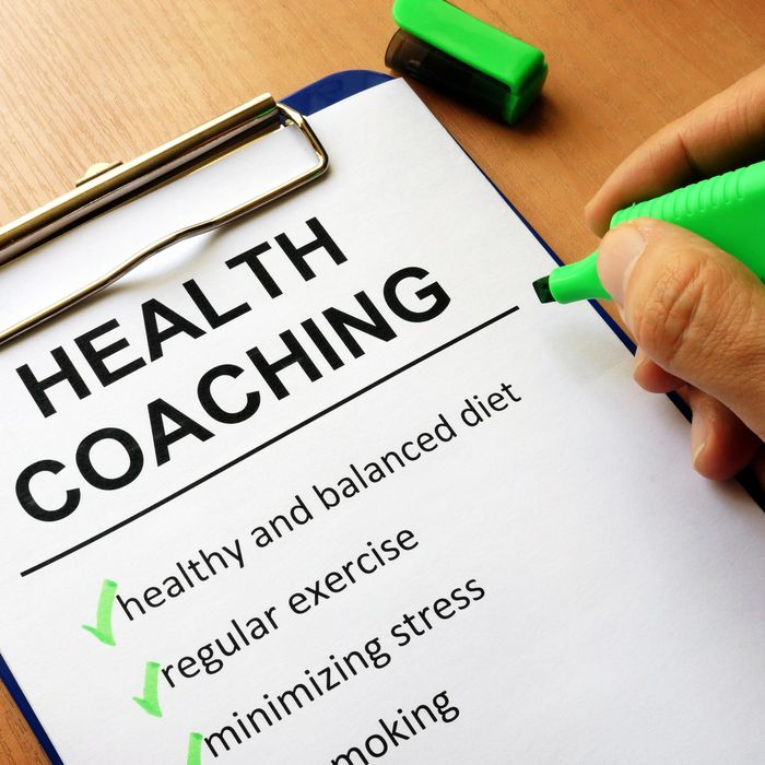 A clipboard with health coaching written on it