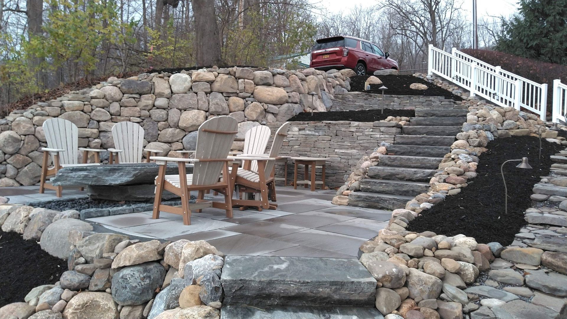 Stone Patio With Wooden Chairs