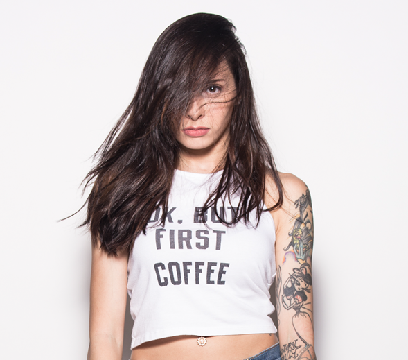 Woman with long dark hair, wearing a