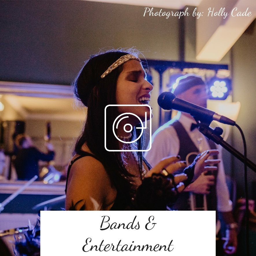 Band performing, singer with microphone, band in background, text overlay