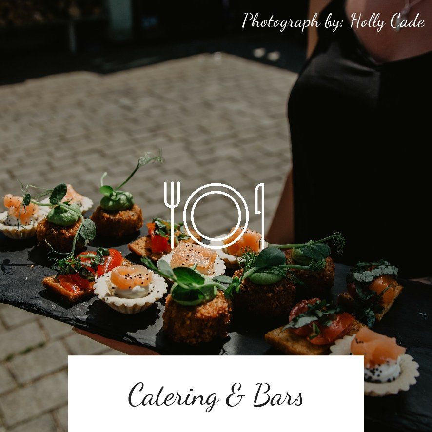 A person holding a platter of appetizers with a