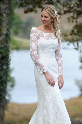 Bride by a lake in a Forget Me Not Designs wedding dress