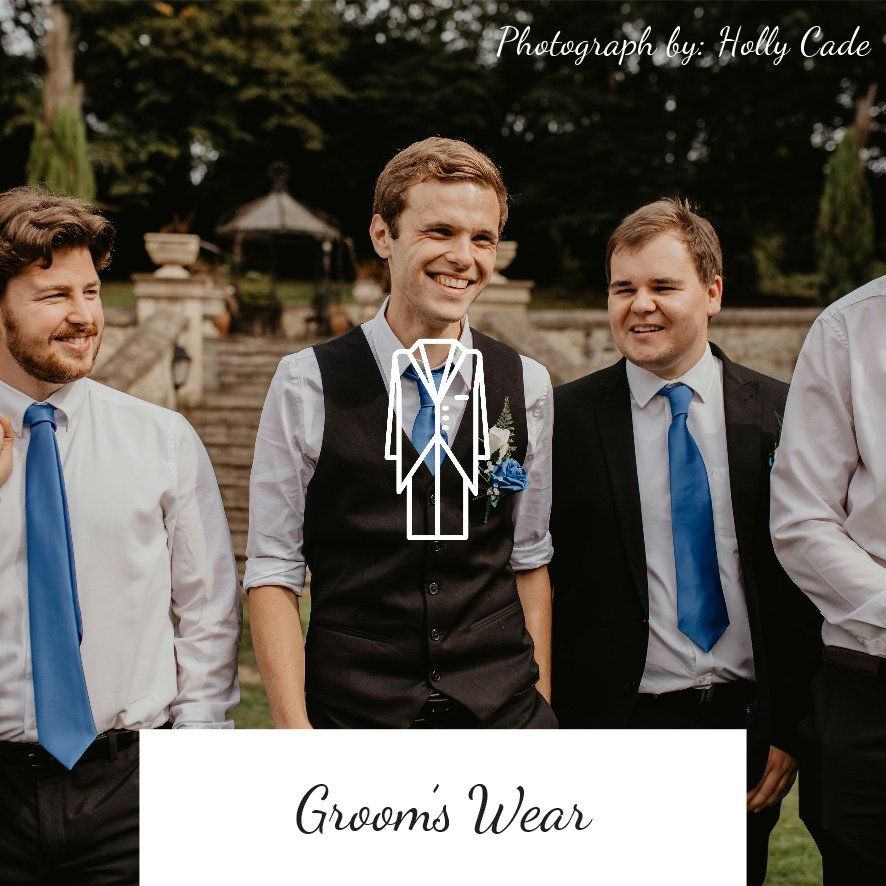 Men in wedding attire, including vests and blue ties, smiling outdoors.