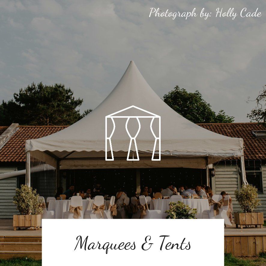 White marquee tent at an outdoor event, with tables and guests inside.