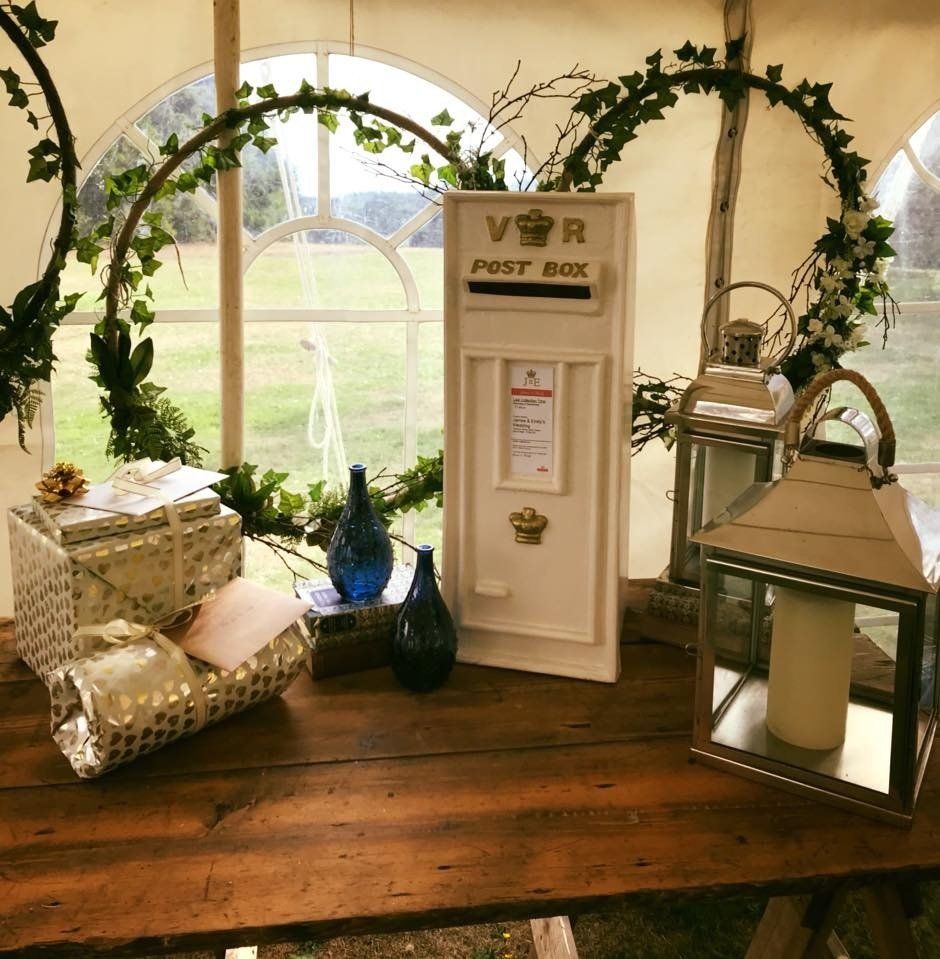 A white post box with 