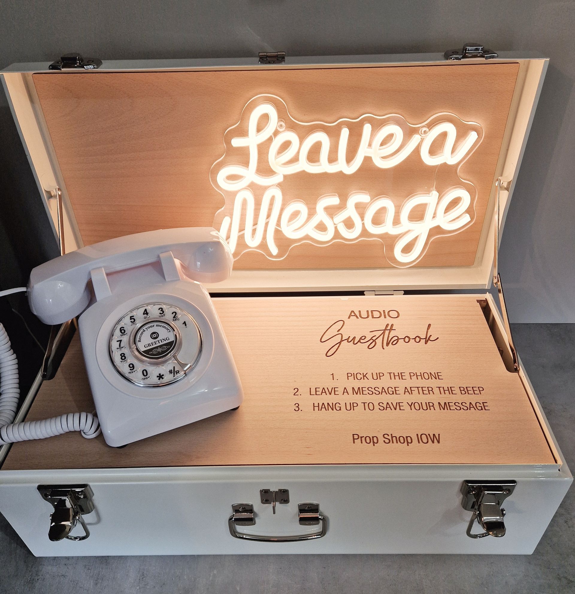 White telephone inside a white box with