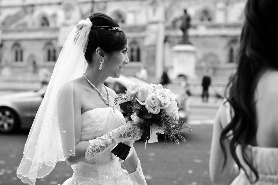 Black & white image of a bride holding her bouquet