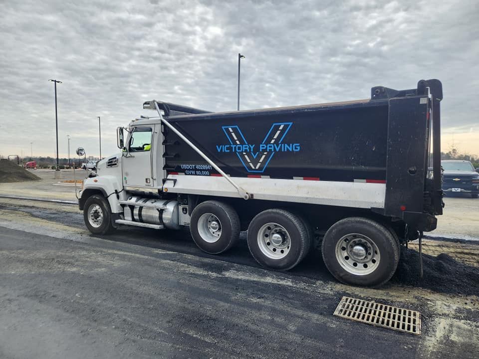 A dump truck is parked on the side of the road