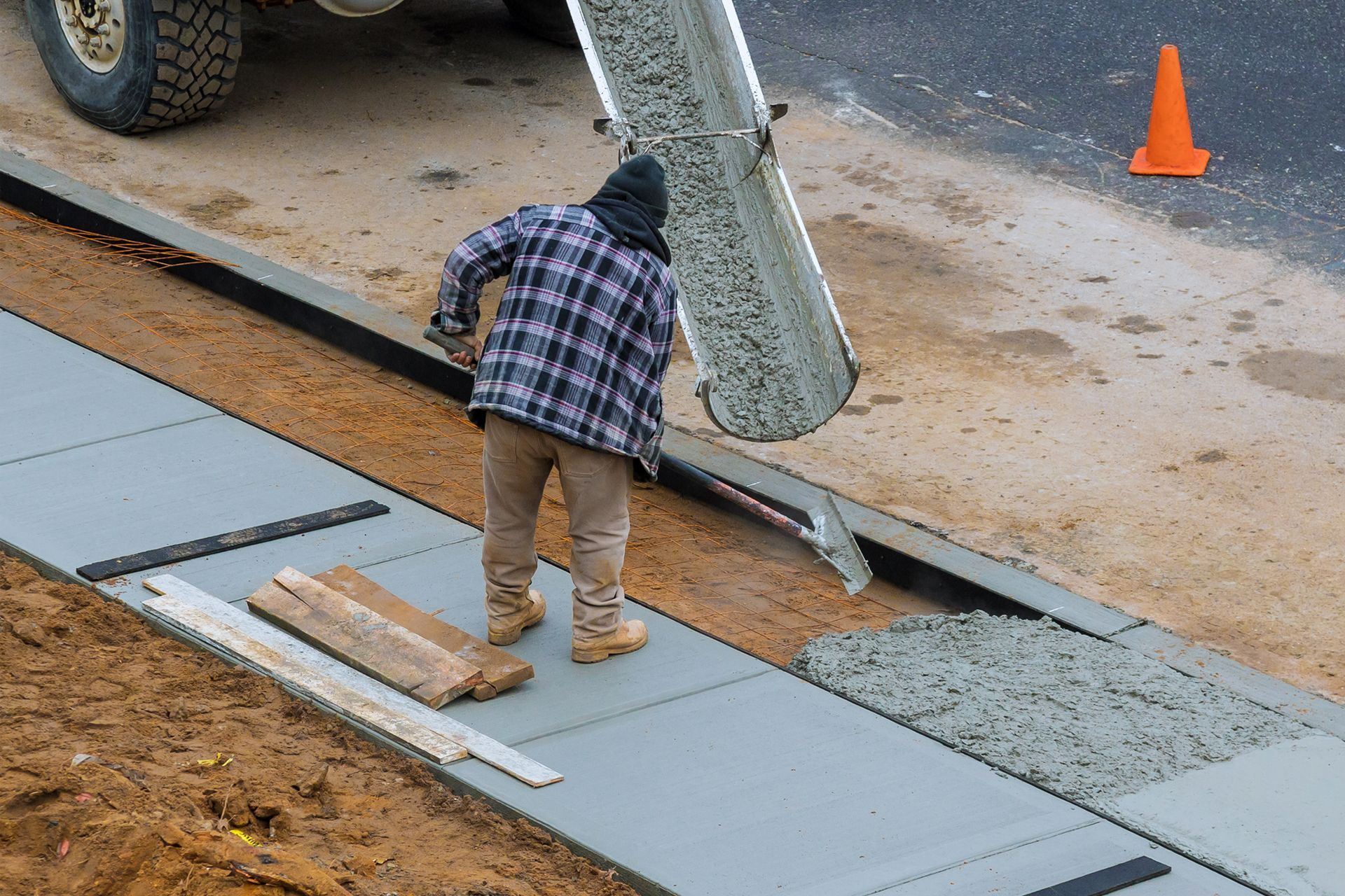 Pouring Concrete Mixture on Walkway