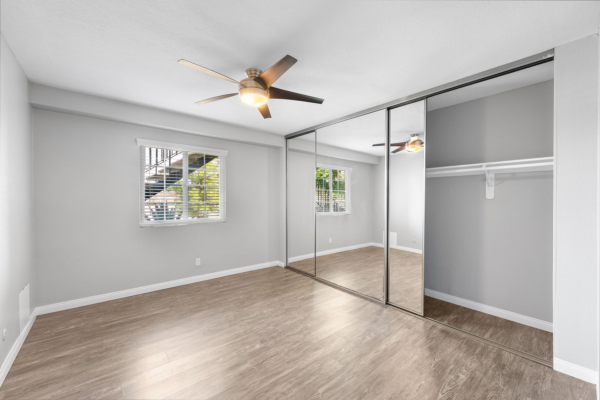 apartment bedroom and mirrored closet