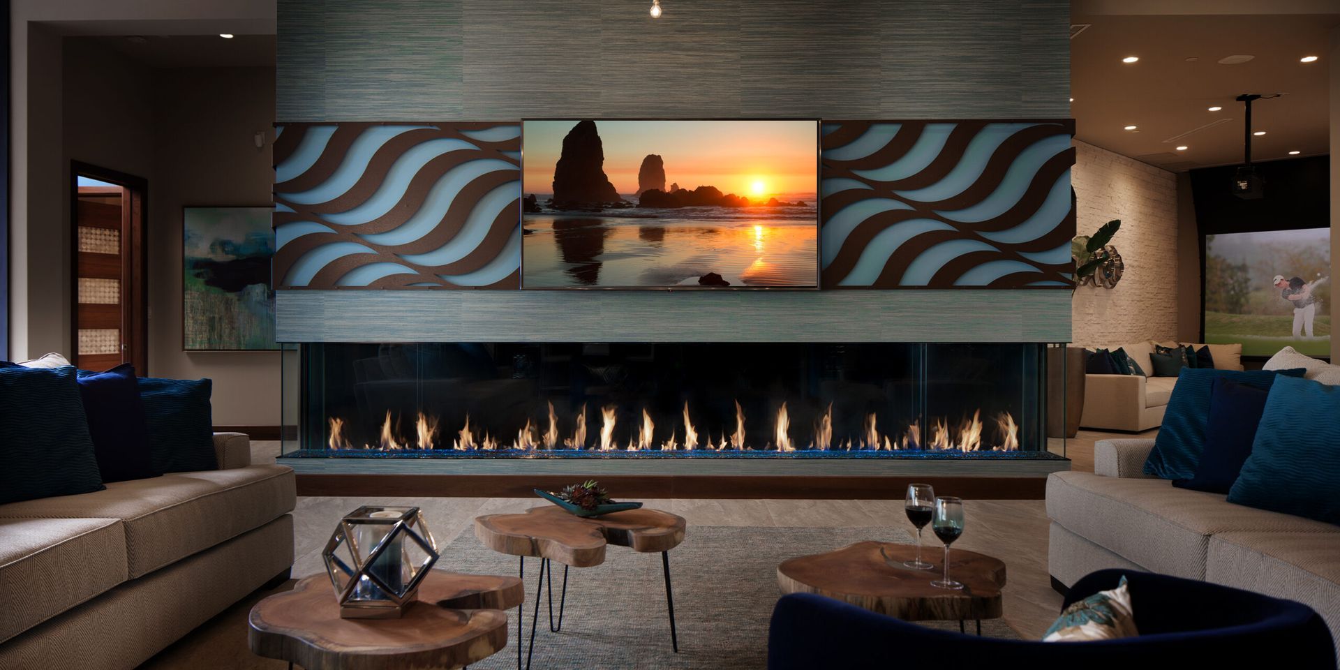 Living room with fireplace, TV and decorative wall panels; two sofas; wooden coffee tables.