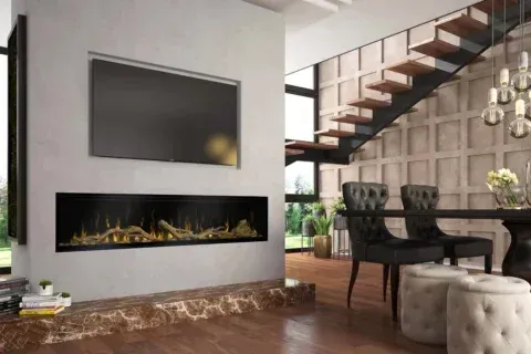 Modern living room with fireplace, TV, and staircase. Black, gold, and wood tones.