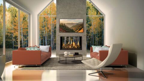 Modern living room with fireplace, rust-colored sofas, and large windows