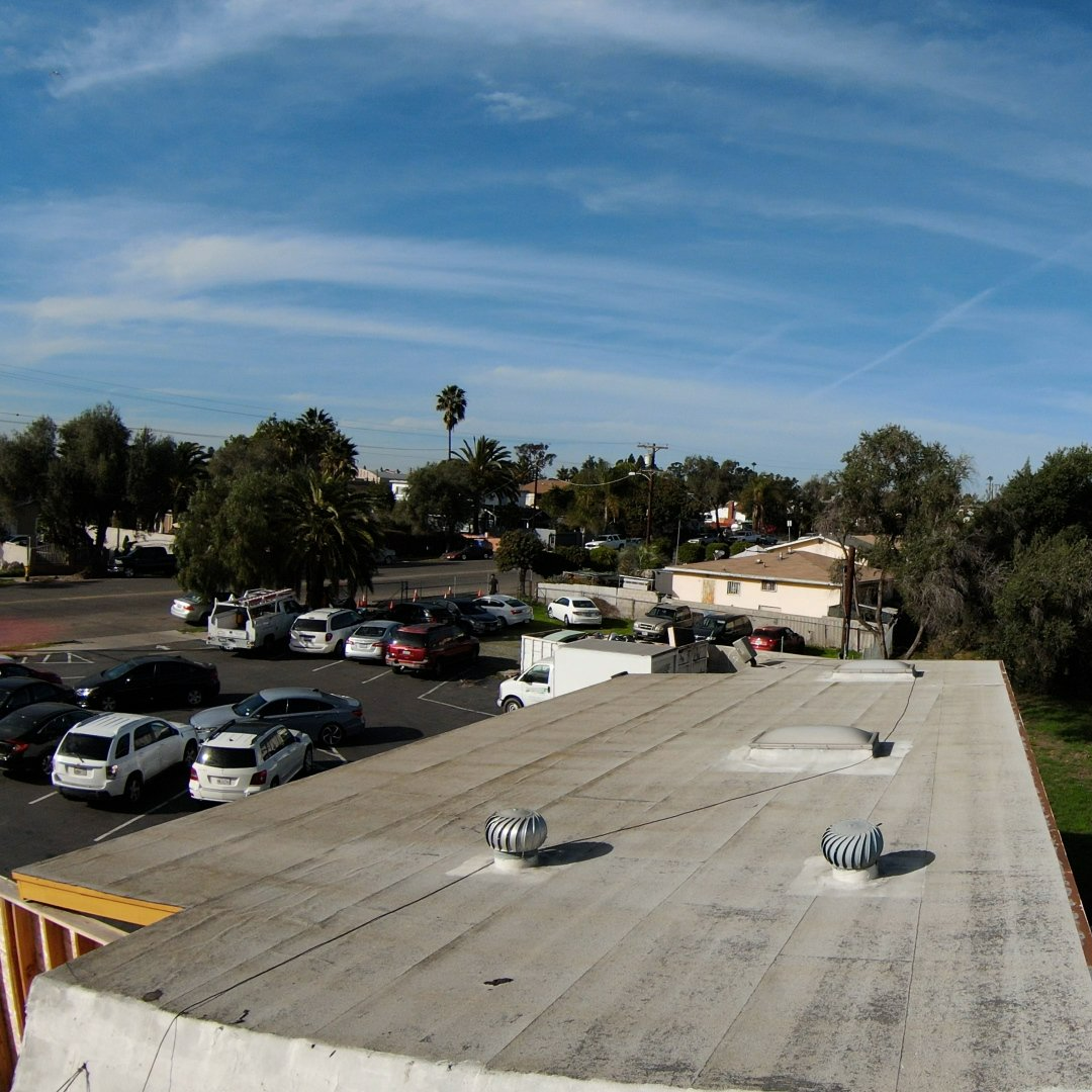 commercial tpo roof replacement before after photo San Ysidro La Bodega Mercado