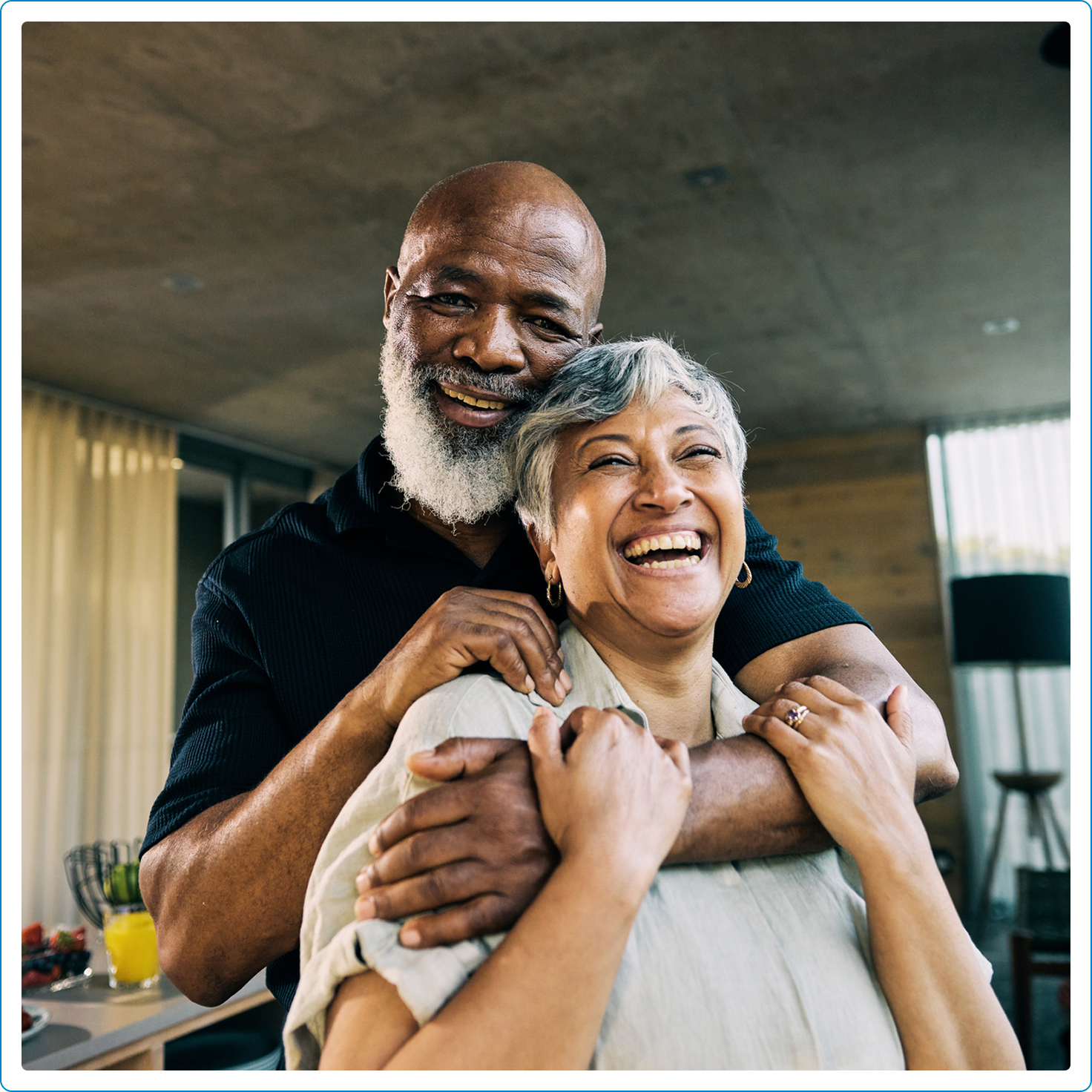 Older couple dancing in the living room