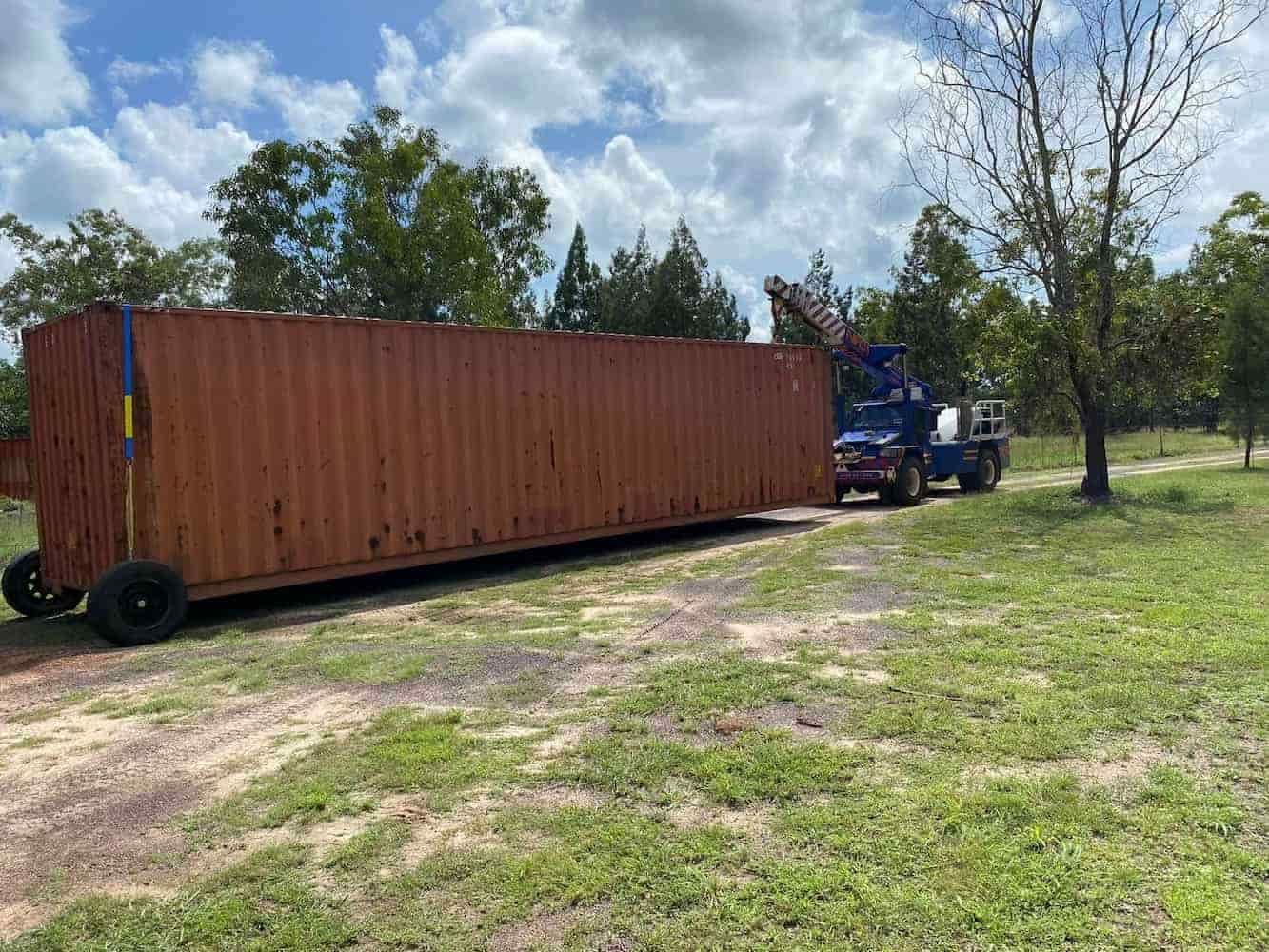 A Large Shipping Container is Being Towed by a Truck — Northern Franna Cranes NT in Jabiru, NT