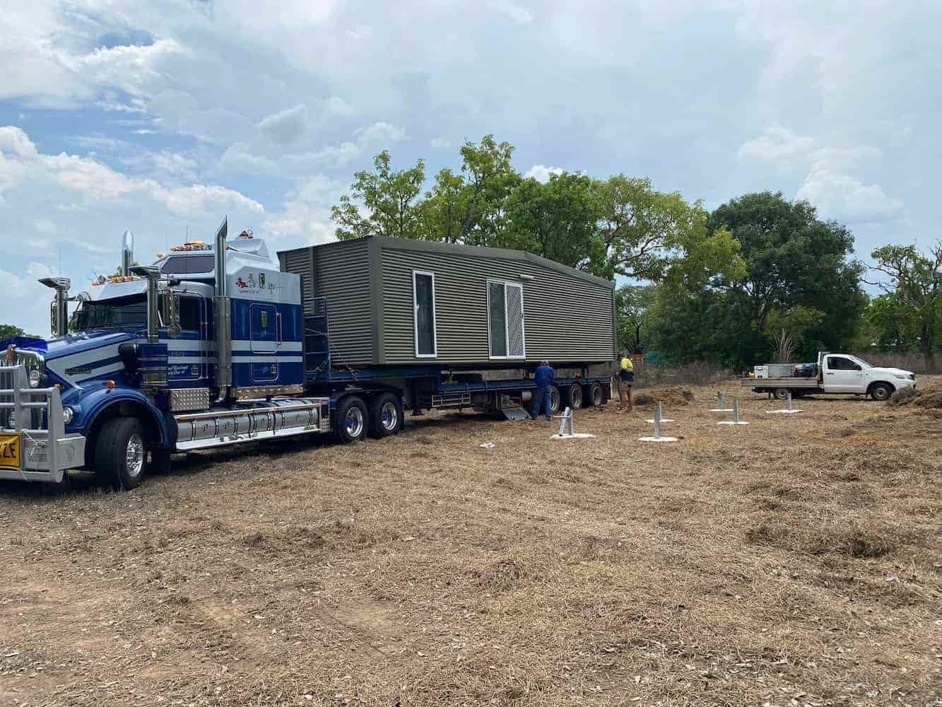 A Semi Truck is Carrying a House on a Trailer — Northern Franna Cranes NT in Noonamah, NT