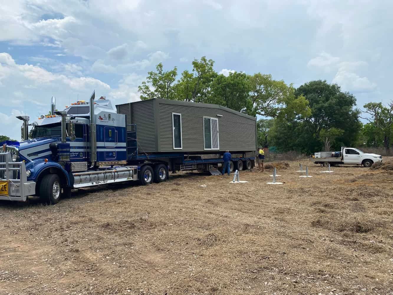 A Semi Truck is Carrying a House on a Trailer — Northern Franna Cranes NT in Noonamah, NT