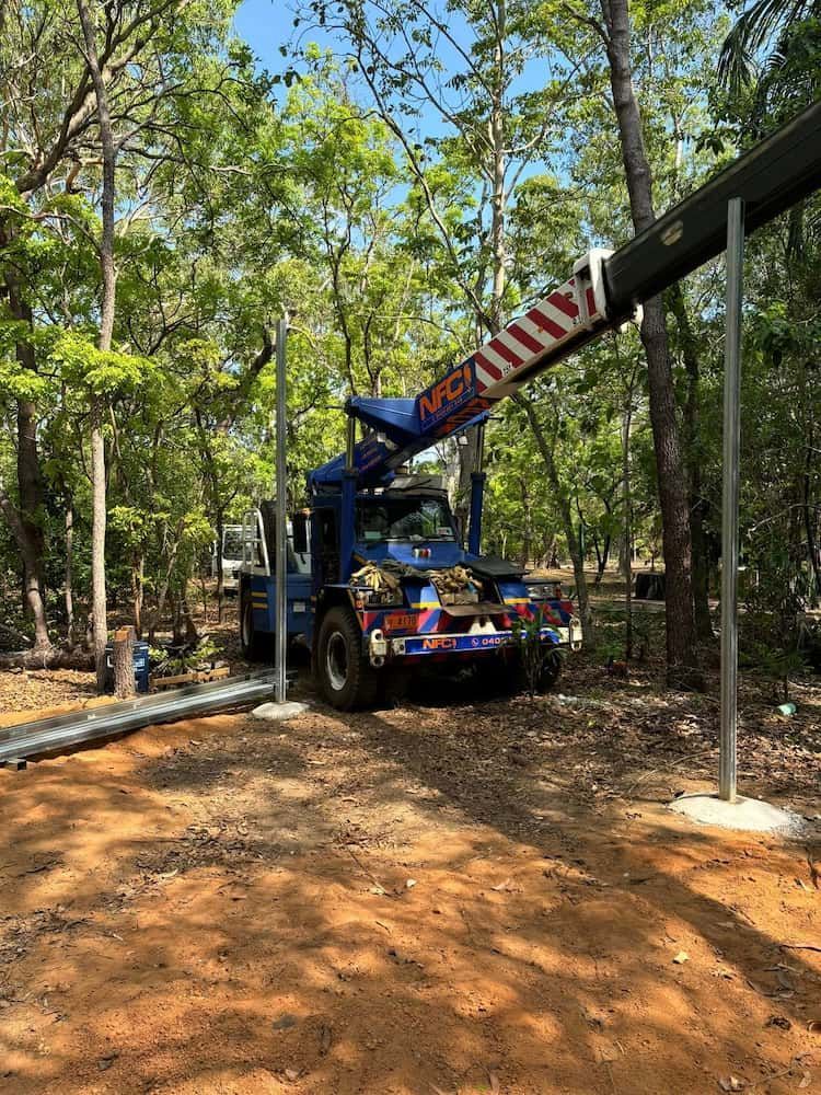 A Crane Is Sitting on Top of A Truck in The Middle of A Forest — Northern Franna Cranes NT in Noonamah, NT