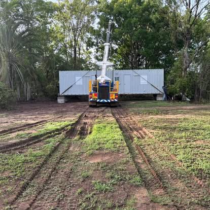 A Truck Is Driving Down a Dirt Road in A Field — Northern Franna Cranes NT in Noonamah, NT