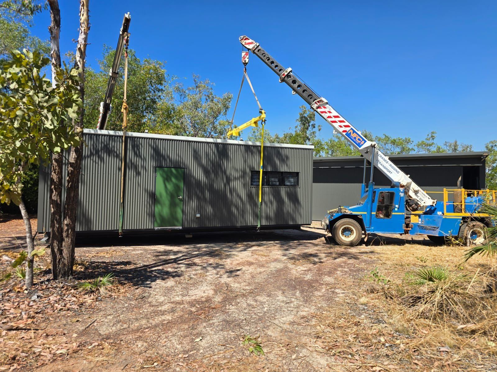 Crane Lifting Portable House in Construction Site