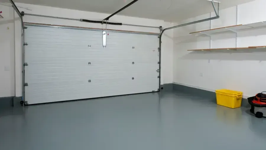 Empty, bright hallway leading to a bright window at the end. Empty, bright hallway leading to a bright window at the end.