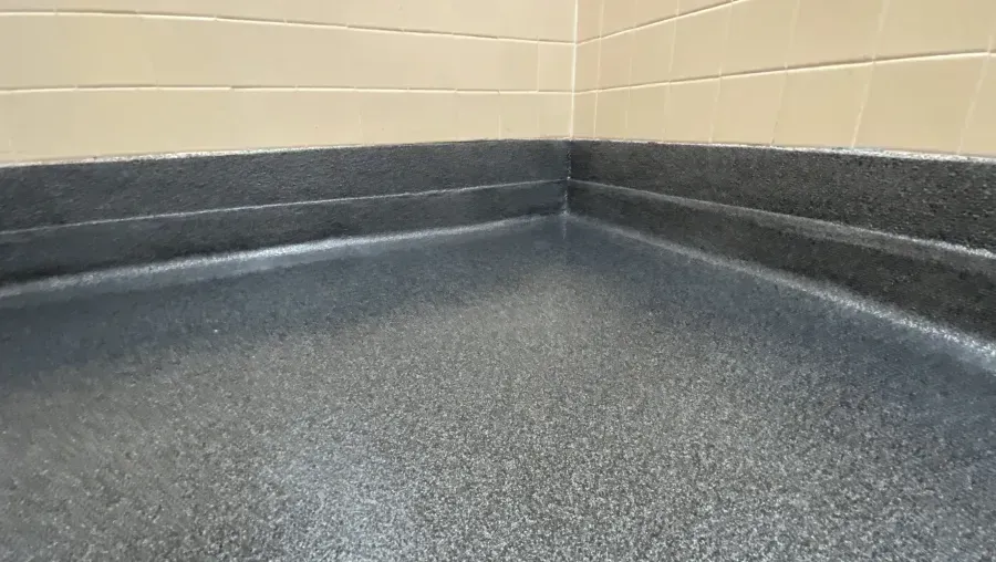 Empty, bright hallway leading to a bright window at the end.