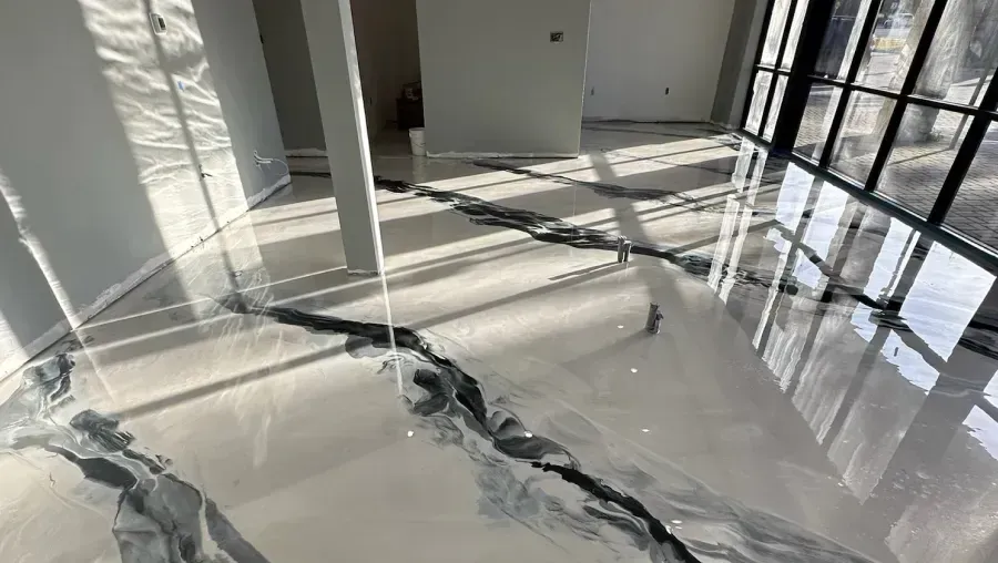 Empty, bright hallway leading to a bright window at the end.