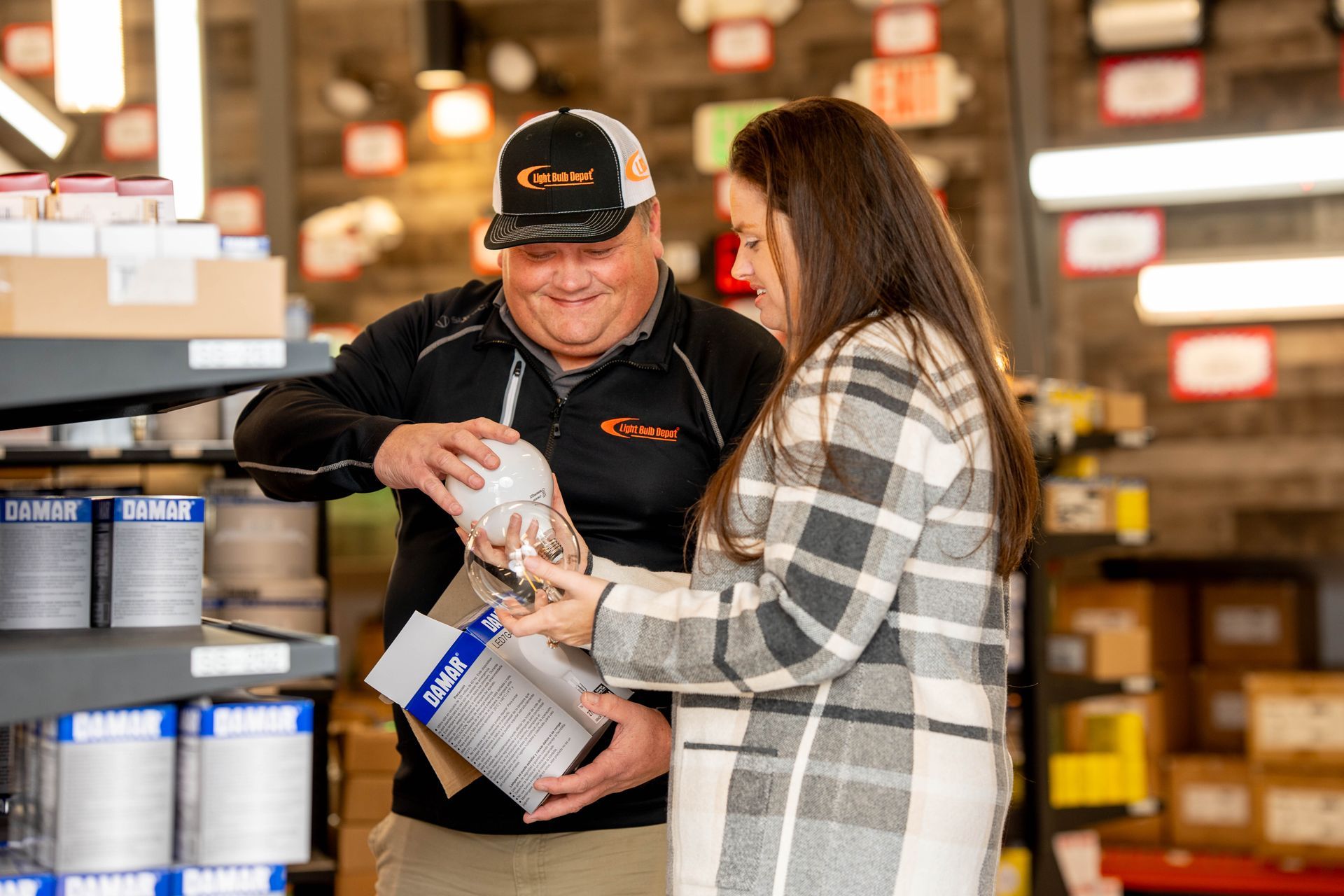 Customer speaking with lighting specialist at Light Bulb Depot store