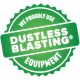 A green sticker that says `` we proudly use dustless blasting equipment ''.