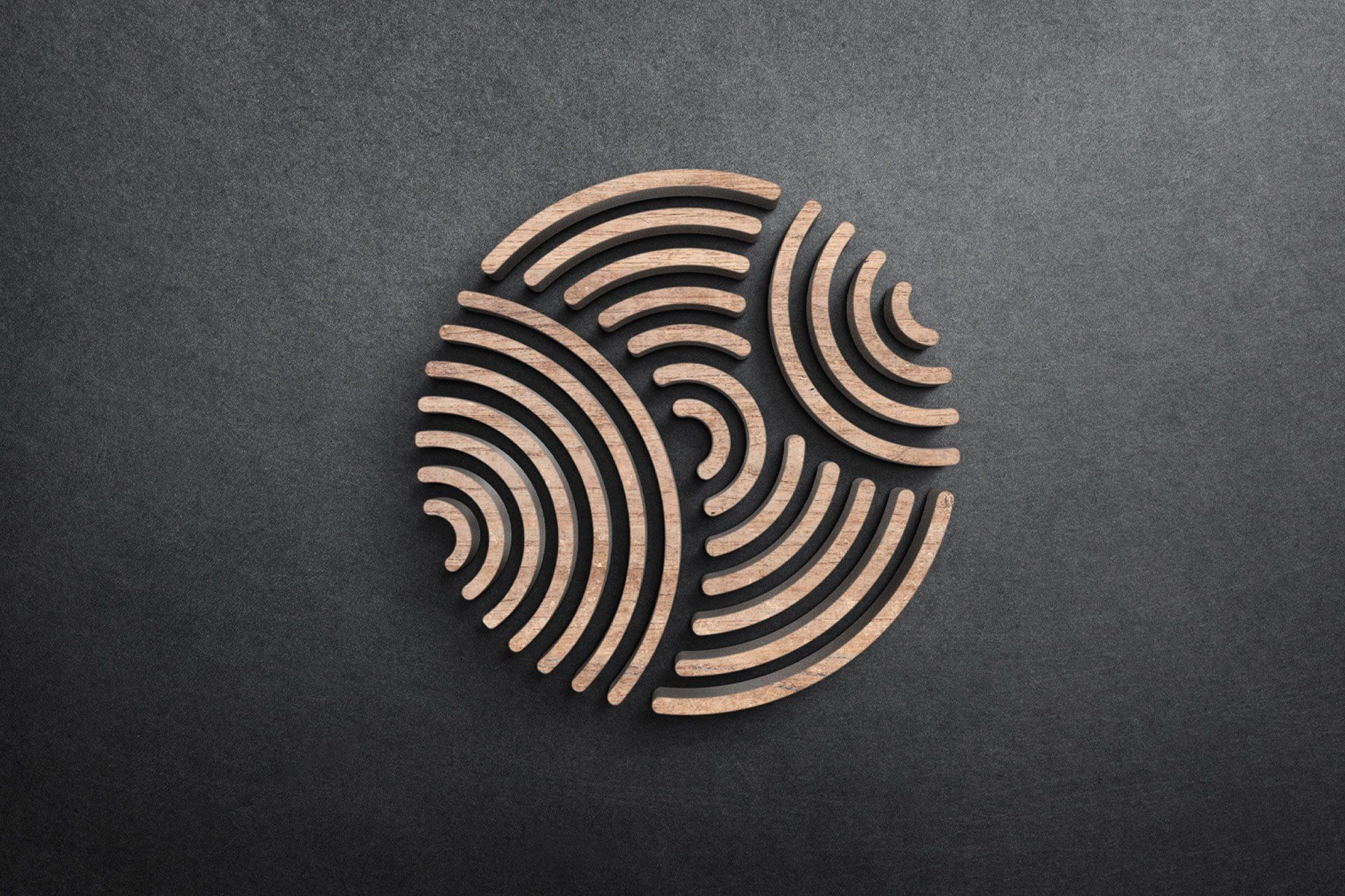Cero logo (icon only) made out of wood and set on a dark background