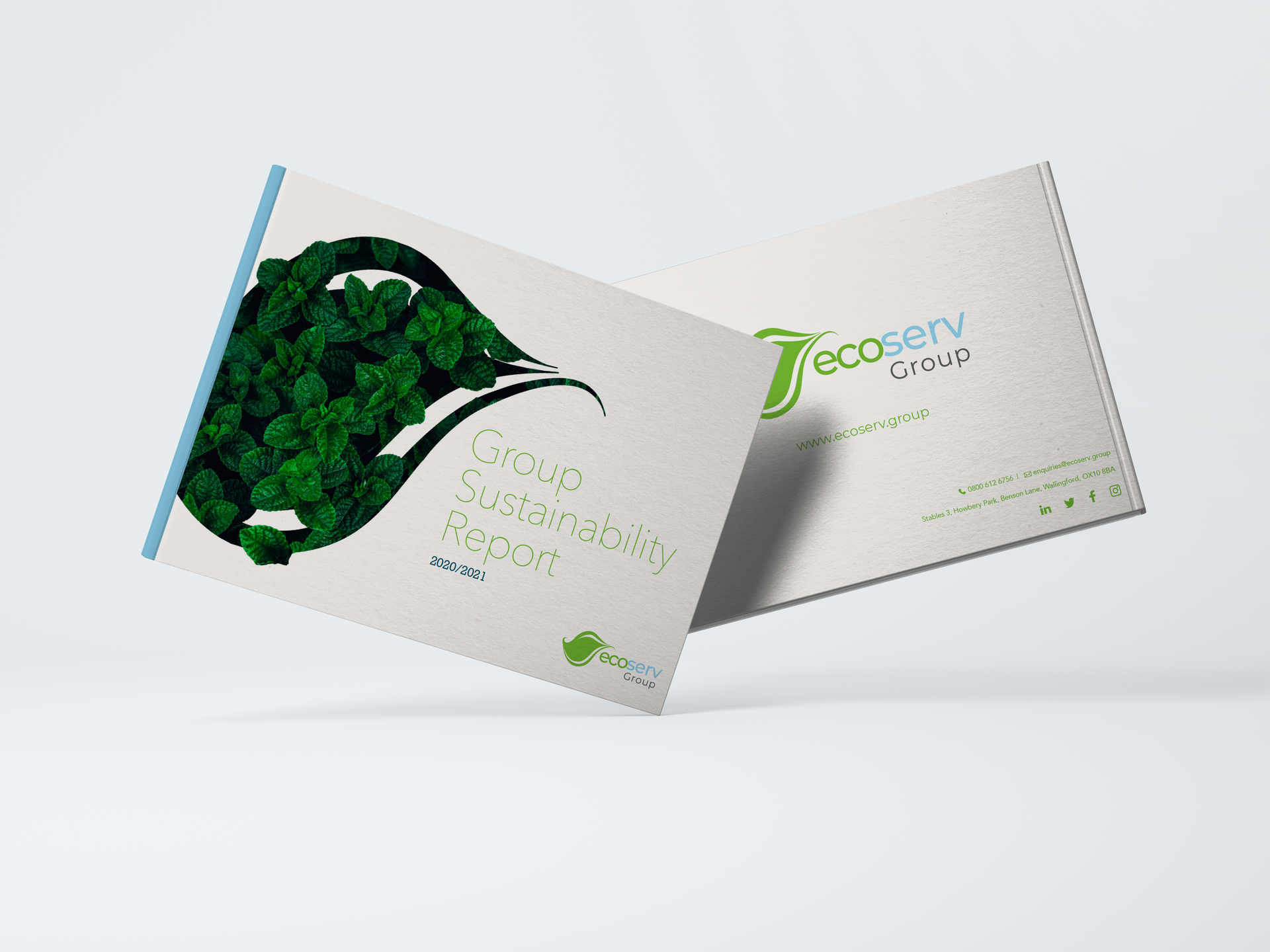 Image of two business cards with the above and beyond logo and some contour designs running across them.